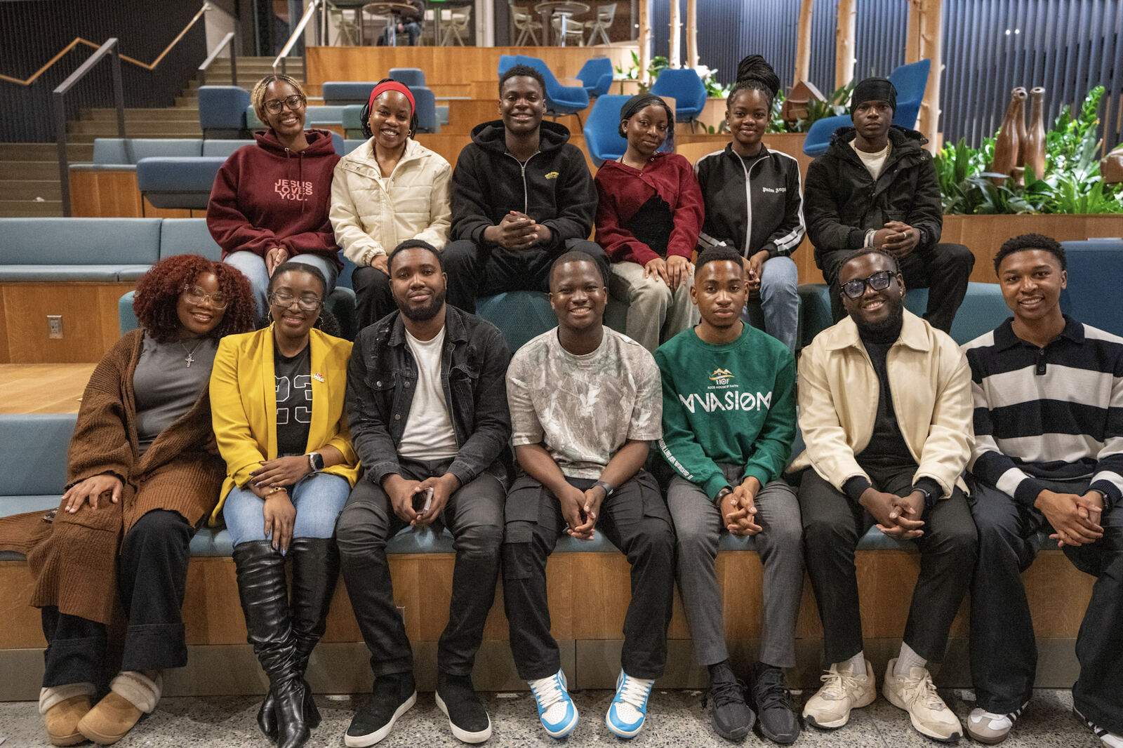 The Generation Of Yahweh family seated together on wooden steps