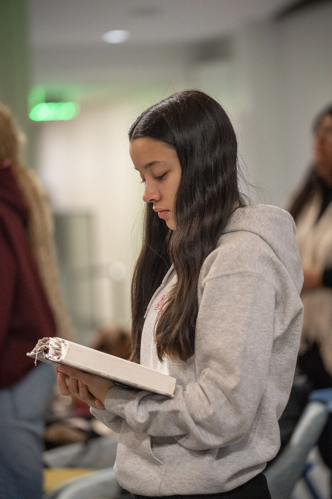 A young woman reading her Bible